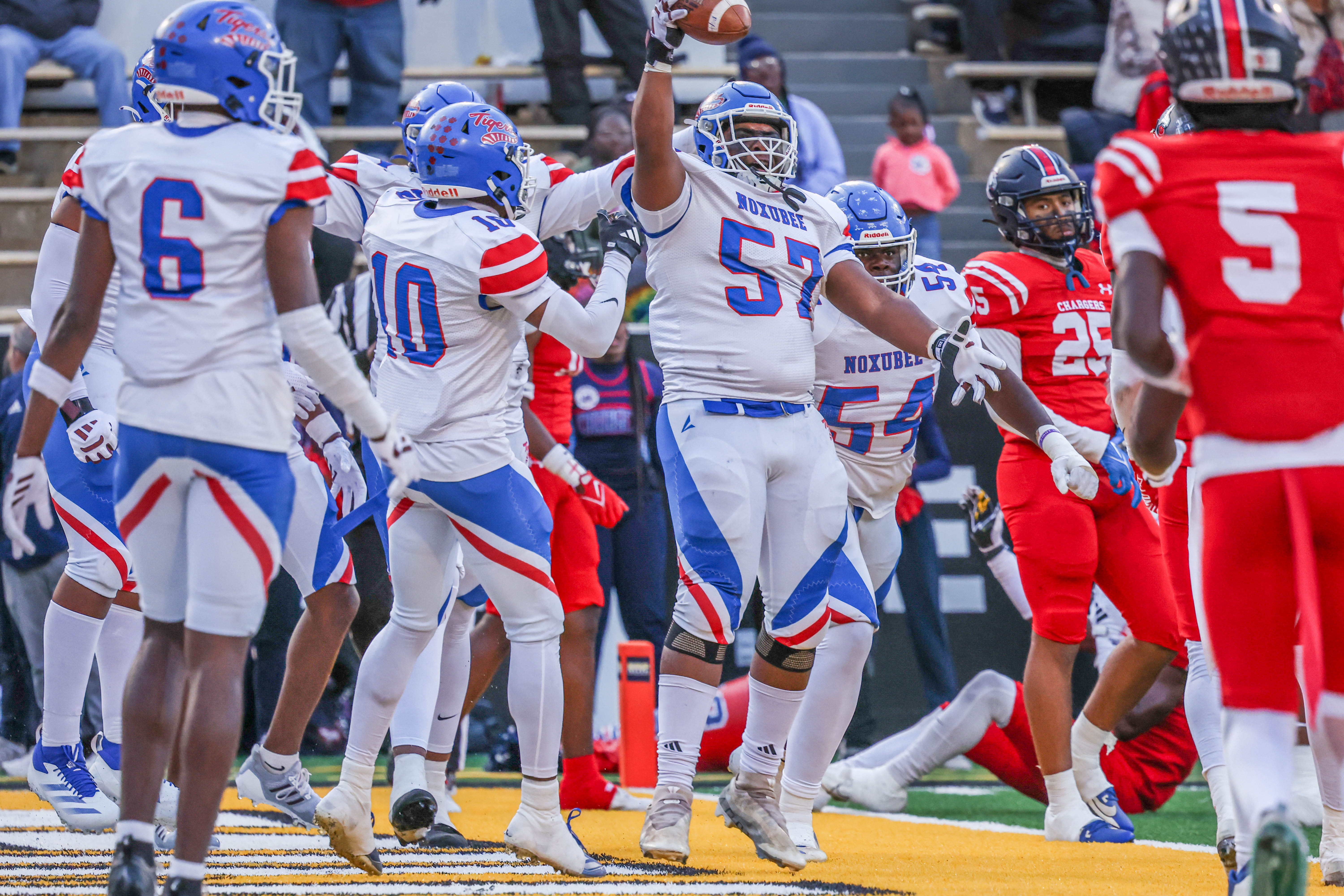 Noxubee County offensive lineman Kaden Phillips celebrates after falling on the ball in the end zone.