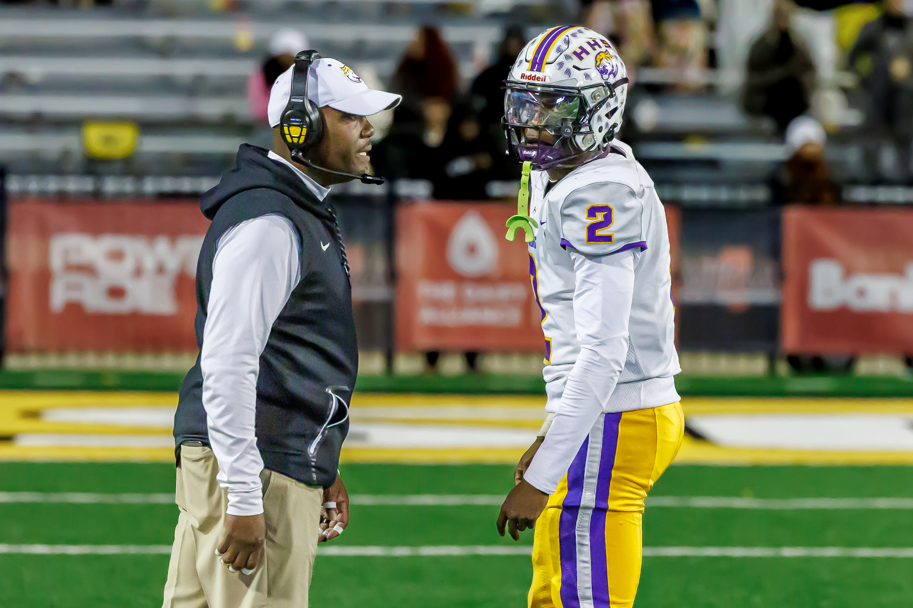 Hattiesburg coach Tony Vance relays a play to quarterback Deuce Vance.