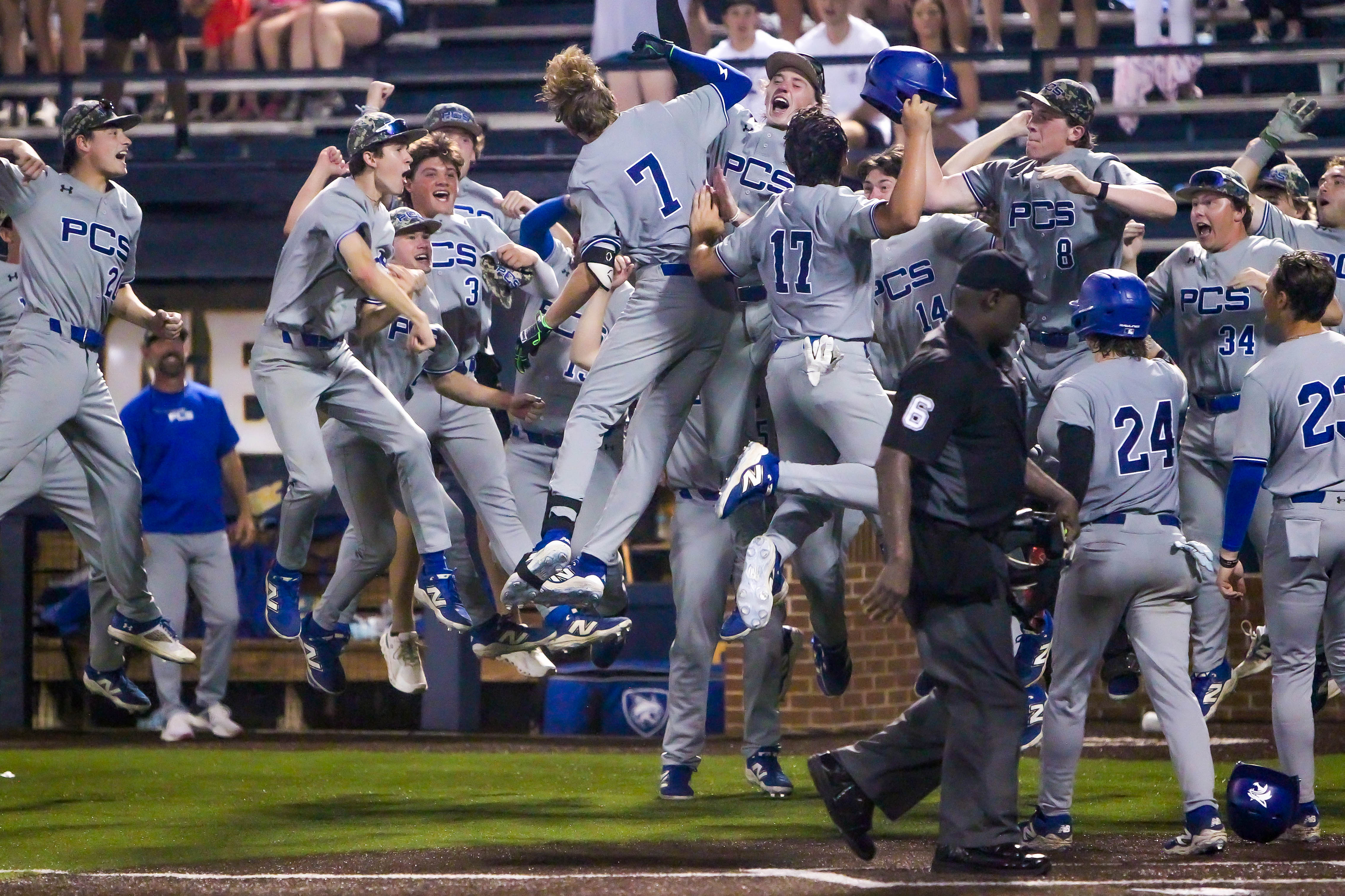 Reed Bridges celebrates with his teammates after hitting a grand slam in the top of the seventh inning. Photo by Andrew Abadie