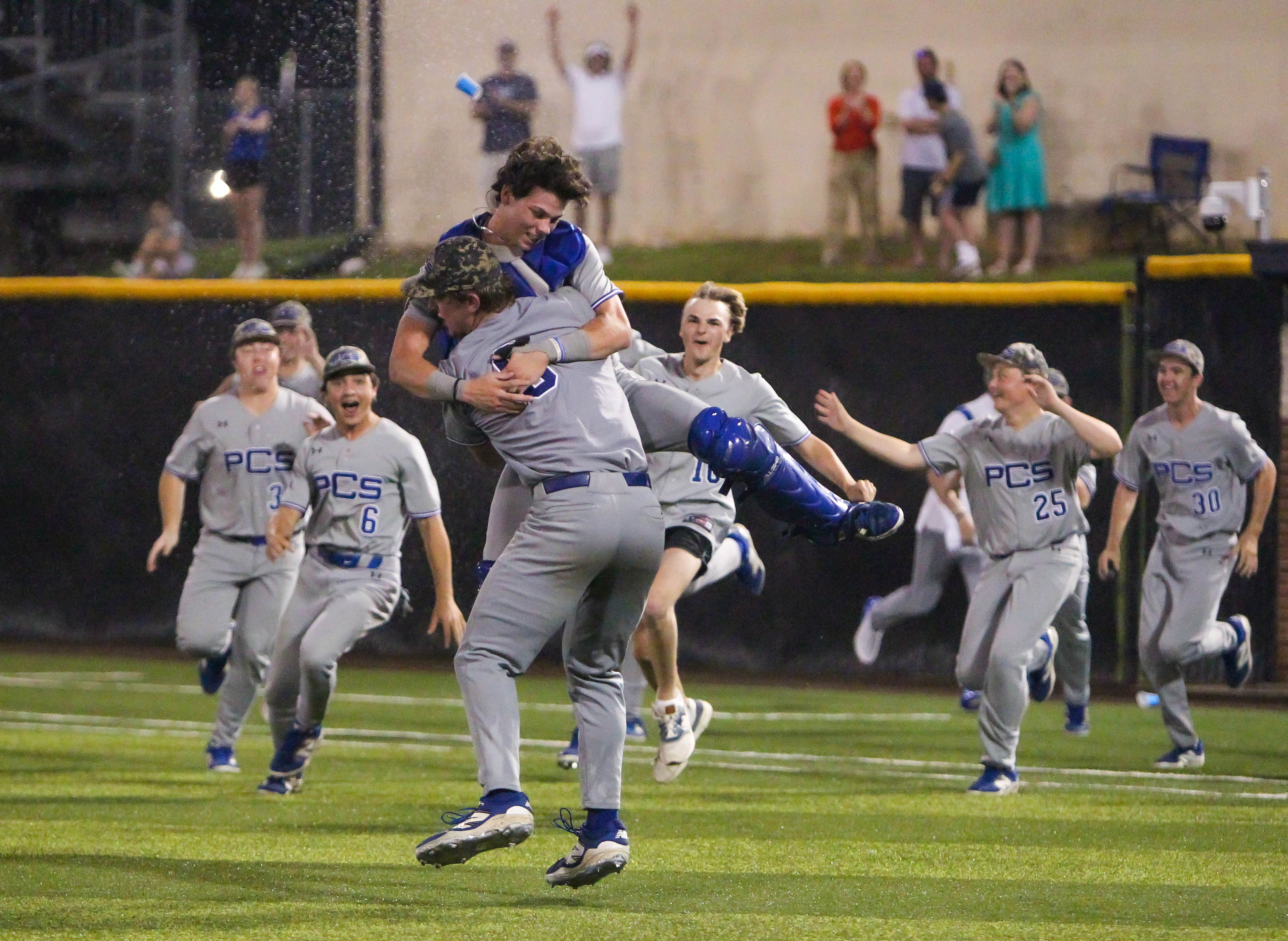 PCS' baseball team dogpiles after recording the final out against Hartfield Academy in the MAIS Class 6A State Championship at Frierson Field on Saturday night. Photo by Andrew Abadie.