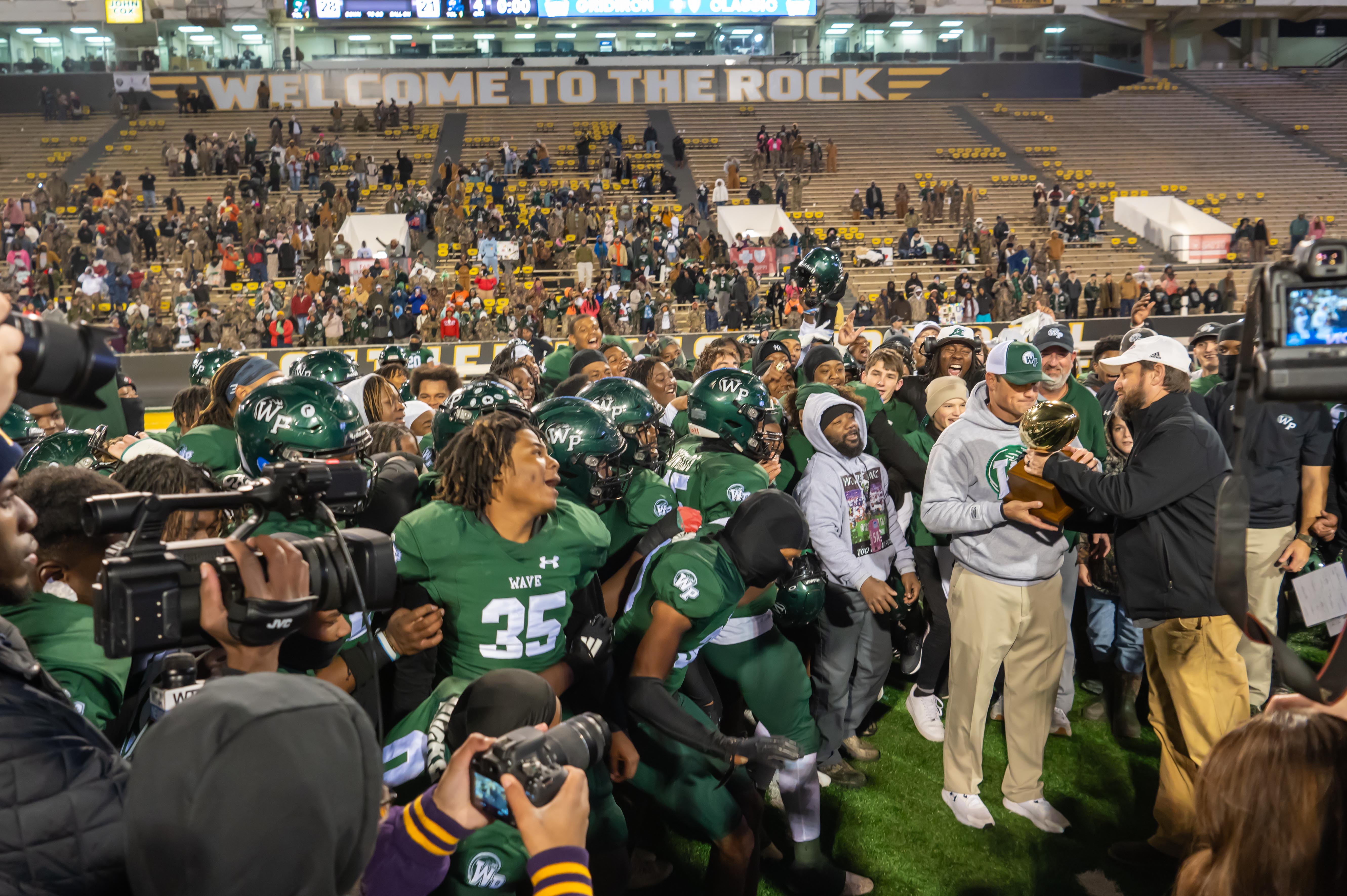 West Point gets presented the state championship trophy.