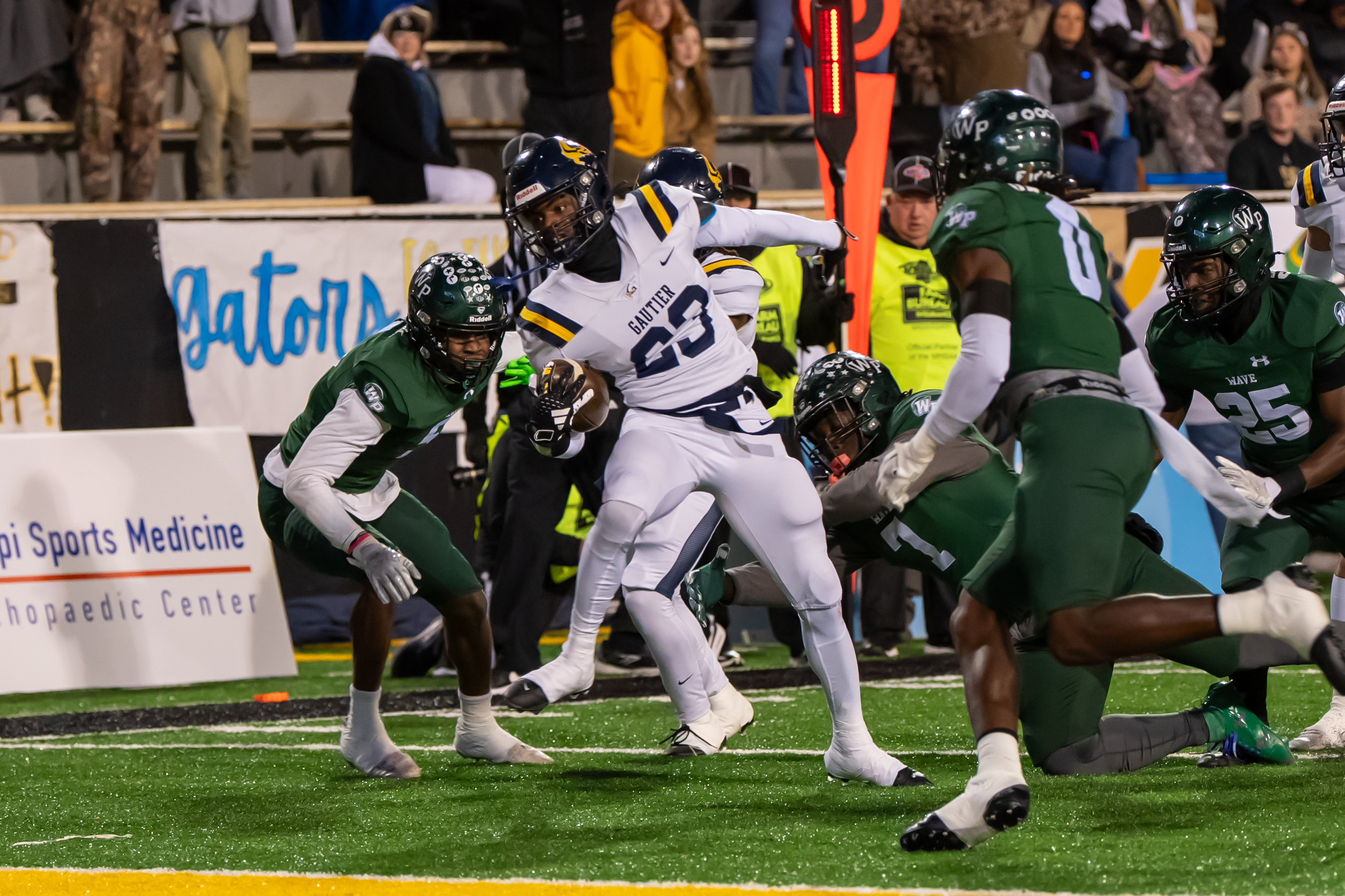 Gautier's Latrell Pogue runs for an 11-yard touchdown.