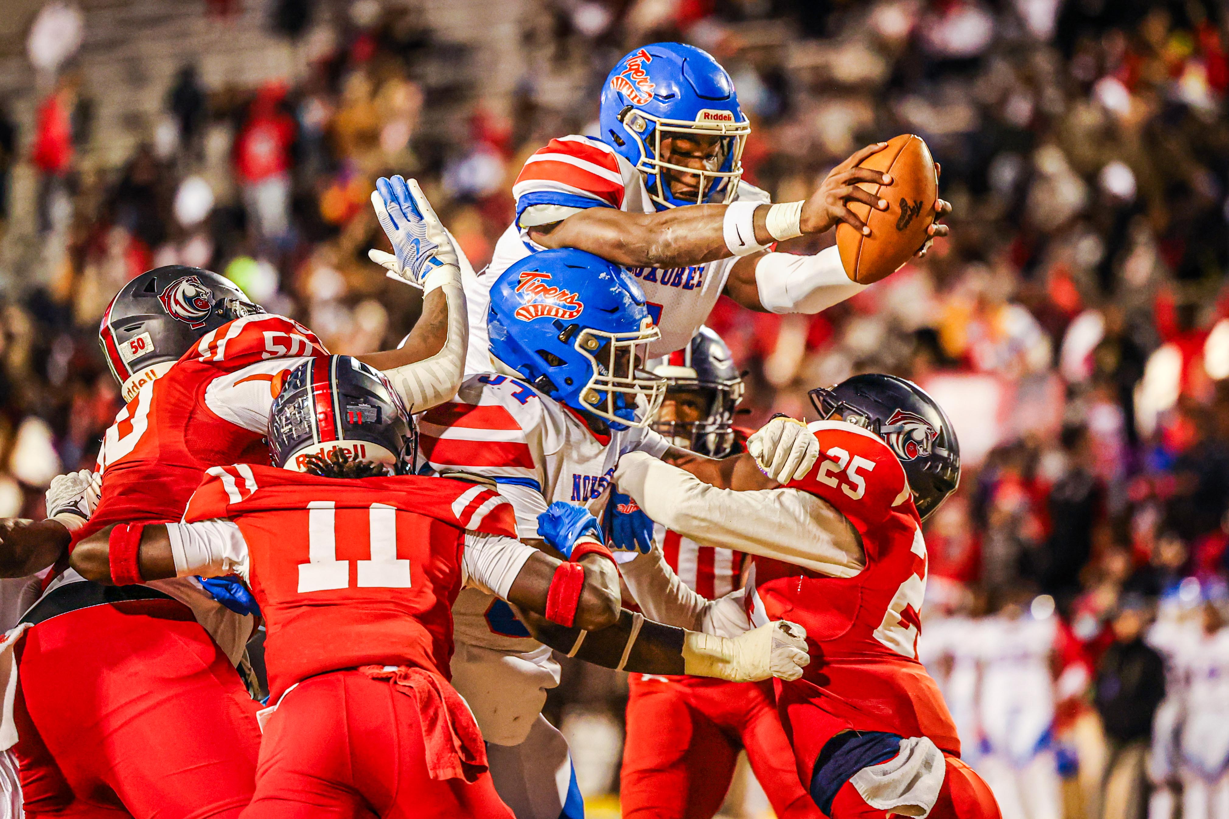 Noxubee County quarterback Kamario Taylor reaches over the end zone to score a two-point conversion.