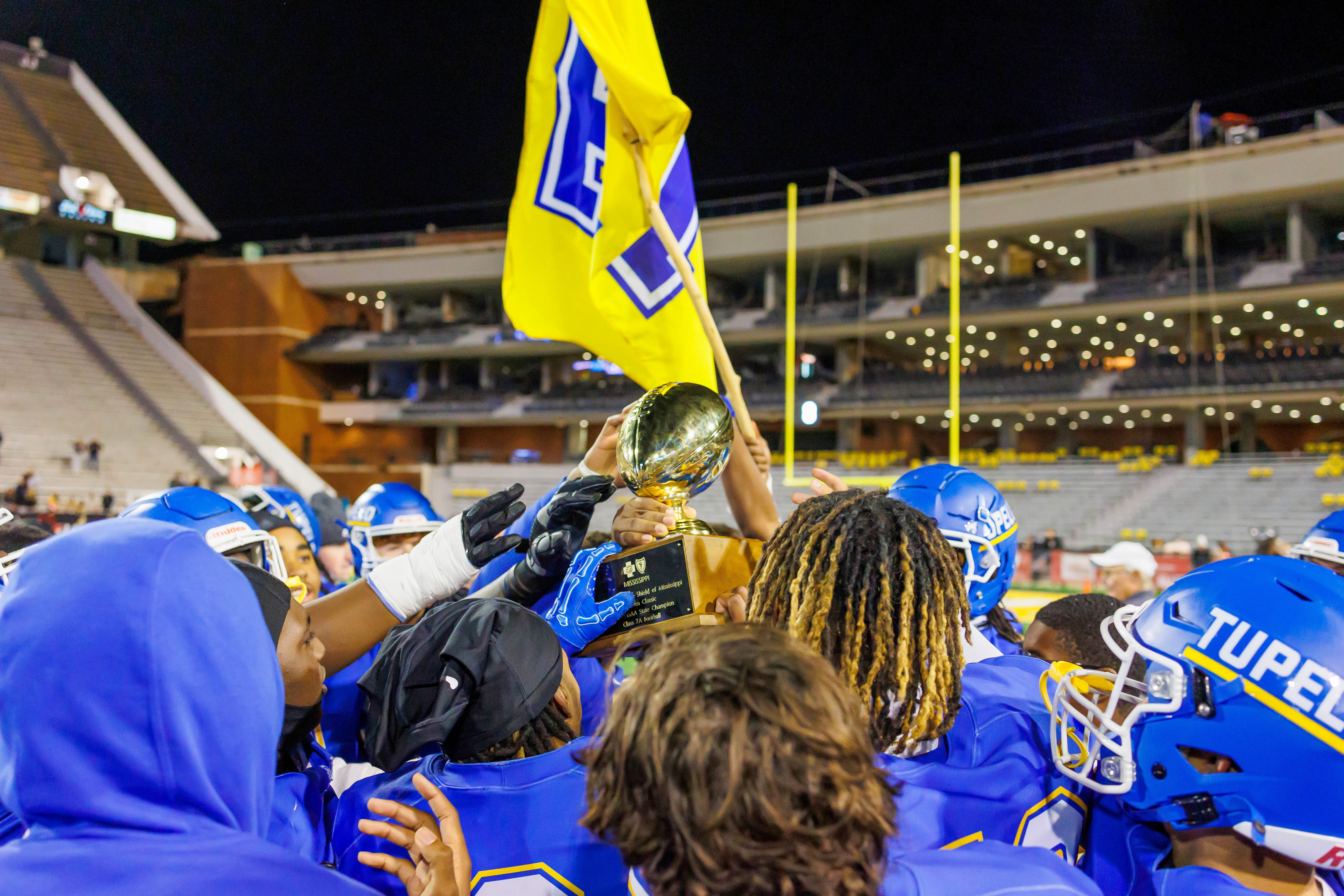 Tupelo celebrates with state championship trophy.