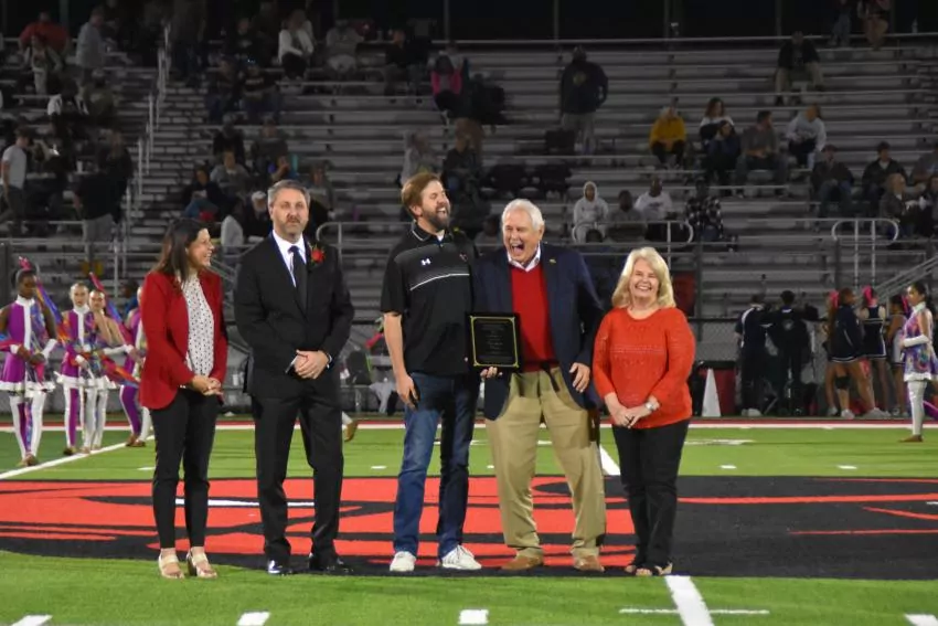 Burkette Ross and his wife, Jackie accepting Champion of the Year award at the Petal homecoming football game. Photo by Cayla Camp Burns 