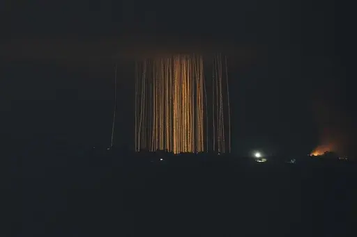 Israeli shelling hits an area in southern Lebanon as seen from northern Israel, Monday, Sept. 30, 2024. (AP Photo/Leo Correa)