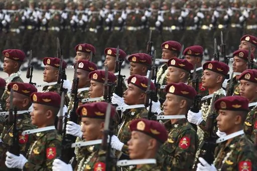 Military officers march during a parade to commemorate Myanmar's 78th Armed Forces Day in Naypyitaw, Myanmar, on March 27, 2023. Myanmar’s military government on Wednesday Feb. 14, 2024 revealed how it will implement its newly activated conscription law, saying it will draft 60,000 young men and women yearly for military service, and that call-ups will begin after the April festival marking the country’s traditional New Year. (AP Photo/Aung Shine Oo, File)
