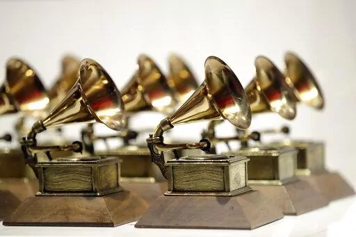 Grammy Awards are displayed at the Grammy Museum Experience at Prudential Center in Newark, N.J. on Oct. 10, 2017. The Grammys are adding a special song for social change award and five new categories including songwriter of the year, giving the Recording Academy an avenue to honor music’s best composer. (AP Photo/Julio Cortez, File)