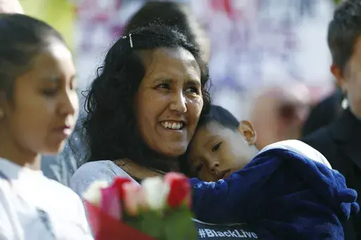 Jeanette Vizguerra, a Mexican immigrant who has lived in a church to avoid immigration authorities for the past three months, smiles after leaving the church early Friday, May 12, 2017, in downtown Denver. (AP Photo/David Zalubowski, File)