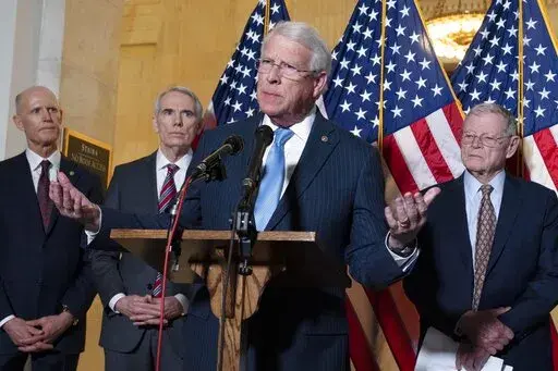 Sen. Roger Wicker, R-Miss., center, accompanied by Sen. Rick Scott, R-Fla., Sen. Rob Portman, R-Ohio, and Sen. Jim Inhofe, R-Okla. speaks during the Senate Armed Services and Senate Foreign Relations GOP news conference on Capitol Hill in Washington, Wednesday, Jan. 19, 2022. ( AP Photo/Jose Luis Magana)