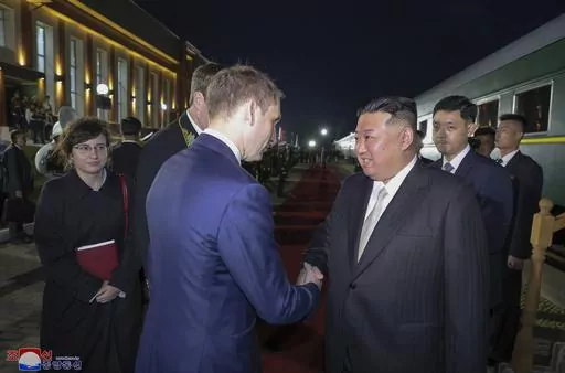 This Tuesday. Sept. 12, 2023, photo provided by the North Korean government shows that North Korea's leader Kim Jong Un, right, is greeted by Russian Minister of Natural Resources and Ecology Alexander Kozlov, left, after crossing the border to Russia at Khasan, about 127 km (79 miles) south of Vladivostok. Independent journalists were not given access to cover the event depicted in this image distributed by the North Korean government. The content of this image is as provided and cannot be inde
