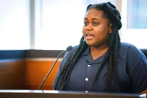 Pieper Lewis gives her allocution during a sentencing hearing, Tuesday, Sept. 13, 2022, in Des Moines, Iowa. Lewis, who was initially charged with first-degree murder after she stabbed her accused rapist to death in June 2020, was sentenced to five years of closely supervised probation and ordered to pay $150,000 restitution to the man’s family. (Zach Boyden-Holmes/The Des Moines Register via AP)