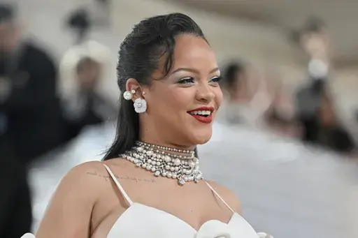 Rihanna shows off her baby bump at The Metropolitan Museum of Art's Costume Institute benefit gala celebrating the opening of the "Karl Lagerfeld: A Line of Beauty" exhibition on Monday, May 1, 2023, in New York. (Photo by Evan Agostini/Invision/AP, File)