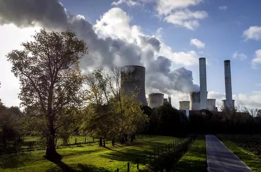 Steam rises from the coal-fired power plant Niederaussem, Germany, on Nov. 2, 2022. The cause of global warming is showing no signs of slowing as heat-trapping carbon dioxide in Earth’s atmosphere increased to record highs in its annual Spring peak, jumping at one of the fastest rates on record, officials announced Monday, June 5, 2023. (AP Photo/Michael Probst, File)