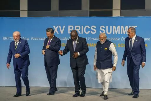 FILE- From left, Brazil's President Luiz Inacio Lula da Silva, China's President Xi Jinping, South Africa's President Cyril Ramaphosa, India's Prime Minister Narendra Modi and Russia's Foreign Minister Sergei Lavrov pose for a BRICS group photo during the 2023 BRICS Summit in Johannesburg, South Africa, Aug. 23, 2023. Modi says his country is “becoming the voice of the Global South,” and that at the upcoming Group of 20 meetings being held in New Delhi that voice will be heard. At the recent