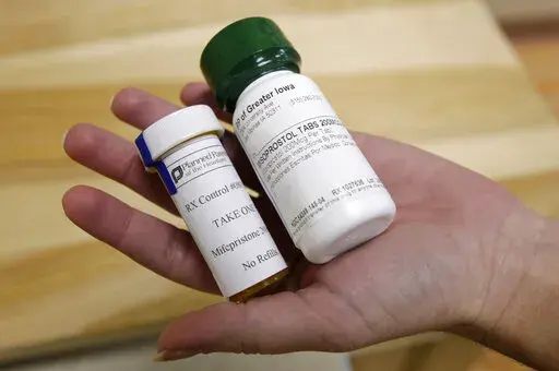 This Sept. 22, 2010 file photo shows bottles of the abortion-inducing drug RU-486 at a clinic in Des Moines, Iowa. On Tuesday, April 13, 2021, the acting head of the Food and Drug Administration said women seeking an abortion pill will not be required to visit a doctor's office or clinic during the COVID-19 pandemic, in the latest reversal in ongoing legal battles over use of the medication. (AP Photo/Charlie Neibergall)