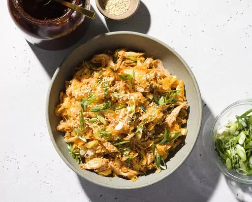 This image released by Milk Street shows a recipe for cabbage and chicken salad with gochujang and sesame. (Milk Street via AP)