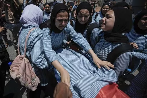 The classmates of 15-year-old Sadeel Naghniyeh carry her body during her funeral in the West Bank Jenin refugee camp Wednesday, June 21, 2023. The death of a 15-year-old girl who was killed by suspected Israeli fire during an Israeli military raid on June 19, is renewing scrutiny of Israel's record of causing civilian deaths during a more than yearlong crackdown on militants in the occupied West Bank. (AP Photo/Majdi Mohammed, File)