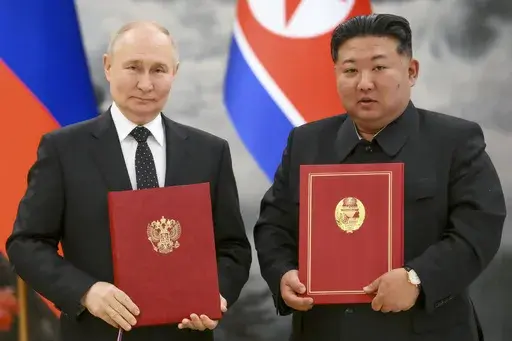 Russian President Vladimir Putin, left, and North Korea's leader Kim Jong Un pose for a photo during a signing ceremony of the new partnership in Pyongyang, North Korea, on June 19, 2024. (Kristina Kormilitsyna, Sputnik, Kremlin Pool Photo via AP, File)