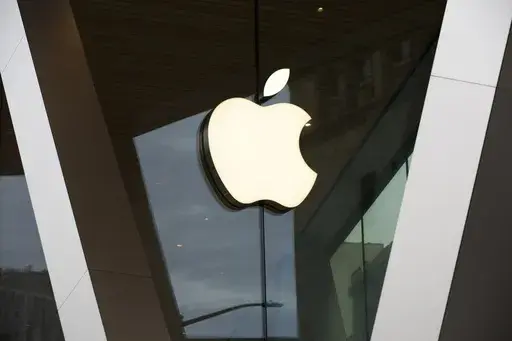 An Apple logo adorns the facade of the downtown Brooklyn Apple store on March 14, 2020, in New York. (AP Photo/Kathy Willens, File)
