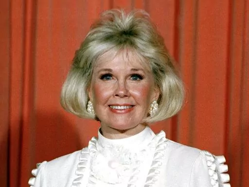 Actor and animal rights activist Doris Day poses for photos after receiving the Cecil B. DeMille Award she was presented with at the annual Golden Globe Awards ceremony in Los Angeles on Jan. 28, 1989. The 100th anniversary of Doris Day’s birthday is being by with a social-media fundraiser honoring her passion for animals. The Doris Day Animal Foundation is asking people to donate to the foundation to help support animal welfare programs nationwide. Day died May 13, 2019, at age 97. (AP Photo,