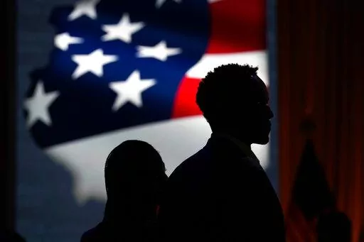 Supporters wait for Democratic incumbent J.B. Pritzker to arrive at an election night event, Tuesday, Nov. 8, 2022, in Chicago. (AP Photo/Nam Y. Huh)