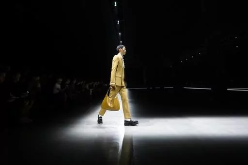A model wears a creation as part of the men's Gucci Fall-Winter 2024-2025 collection, that was presented in Milan, Italy, Friday, Jan. 12, 2024. (AP Photo/Luca Bruno).