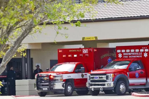 Brownsville Fire Department EMS Ambulances with two surviving U.S. citizens arrive at Valley Regional Medical Center, Tuesday, March 7, 2023, in Brownsville, Texas, after having been kidnapped and shot at by gunmen in Matamoros, Mexico. The March 3 shooting left two other Americans dead. (Miguel Roberts/The Brownsville Herald via AP)