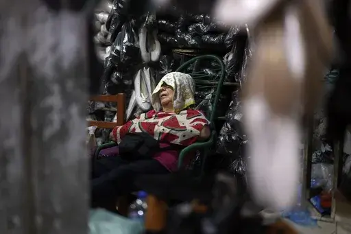 A vendor sleeps on a hot afternoon at her shop at Market 4 in Asuncion, Paraguay, Jan. 17, 2025. (AP Photo/Jorge Saenz, File)