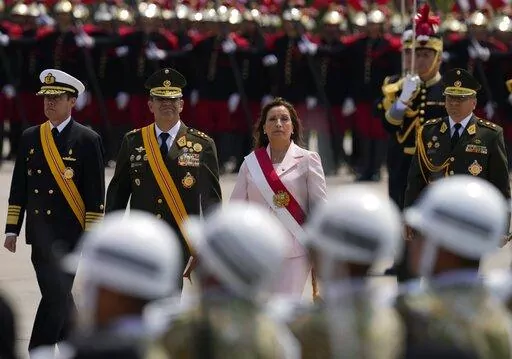 Peru's new President Dina Boluarte attends a ceremony marking Army Day in Lima, Peru, Friday, Dec. 9, 2022. Peru's Congress voted to remove President Pedro Castillo from office Wednesday and replace him with the vice president, Boluarte, shortly after Castillo tried to dissolve the legislature ahead of a scheduled vote to remove him. (AP Photo/Martin Mejia)