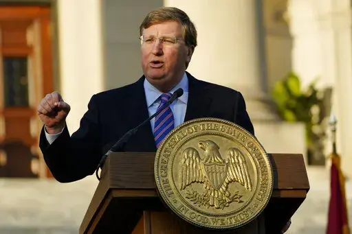 Mississippi Gov. Tate Reeves delivers his State of the State address outside the Mississippi Capitol in Jackson, Miss., Jan. 25, 2022. Reeves is a supporter of eliminating the state's personal income tax. (AP Photo/Rogelio V. Solis, File)