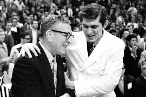 UCLA Bruins coach John Wooden, left, is congratulated by Jacksonville coach Joe Williams after UCLA beat the Dolphins, 80-69, in the national championship game of the NCAA college basketball tournament on March 21, 1970, in College Park, Md. Williams, who coached Artis Gilmore and tiny Jacksonville University to the 1970 NCAA Tournament championship game against mighty UCLA, died Saturday, March 26, 2022, in Enterprise, Miss., while in hospice care after a lengthy battle with cancer, his son Joe