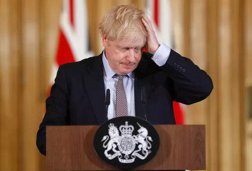 Britain's Prime Minister Boris Johnson reacts during a press conference at Downing Street on the government's coronavirus action plan in London Tuesday, March 3, 2020. (AP Photo/Frank Augstein, File)