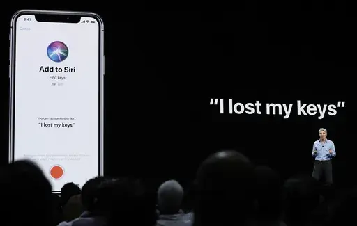 Craig Federighi, Apple's senior vice president of Software Engineering, speaks about Siri during an announcement of new products at the Apple Worldwide Developers Conference in San Jose, Calif., June 4, 2018. (AP Photo/Marcio Jose Sanchez, File)
