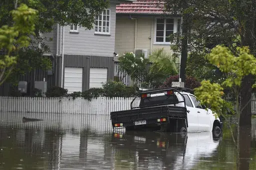 A vehicle sits in flood waters in the Brisbane suburb of Oxley, Australia, Monday, March 10, 2025. (Jono Searle/AAP Image via AP)