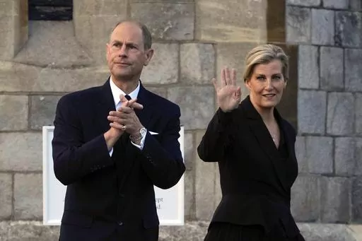 Britain's Prince Edward and Sophie, Countess of Wessex, wave to mourners outside the Windsor Castle in Windsor, England, on Sept. 16, 2022. Britain’s King Charles III has made his youngest brother the Duke of Edinburgh, passing on a title held by their late father, Prince Philip. Buckingham Palace said the title was conferred on Prince Edward on Friday, March 10, 2023, his 59th birthday. (AP Photo/Kin Cheung, File)