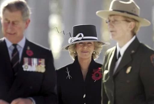 Camilla, Duchess of Cornwall, center, Britain's Prince Charles, left, and Vikki Keys, Superintendent of the National Mall and Memorial Parks visit the World War II Memorial in Washington, Friday, Nov. 4, 2005. Britain's queen consort, Camilla, has come a long way. On May 6, she will be crowned alongside her husband and officially take her first turns on the world stage as Queen Camilla. (Jason Reed, Pool Photo via, File)