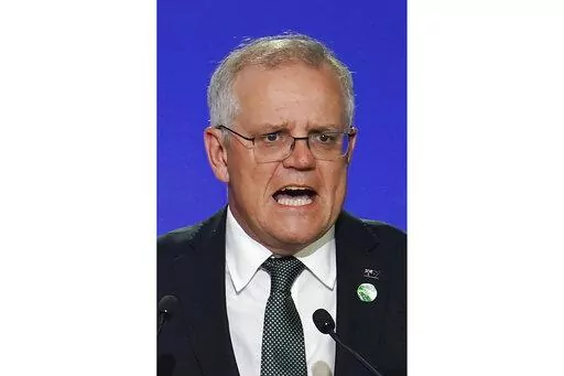 Australia's Prime Minister Scott Morrison delivers an address, during the COP26 Summit, at the SECC in Glasgow, Scotland, Monday, Nov. 1, 2021. In at least one sense, Morrison is the most successful Australian prime minister in years. He is the first to survive in office from one election to the next since 2007. That year, the government of Australia's second-longest-serving Prime Minister John Howard was voted out after a reign of almost 12 years. (Ian Forsyth/Pool Photo via AP, File)
