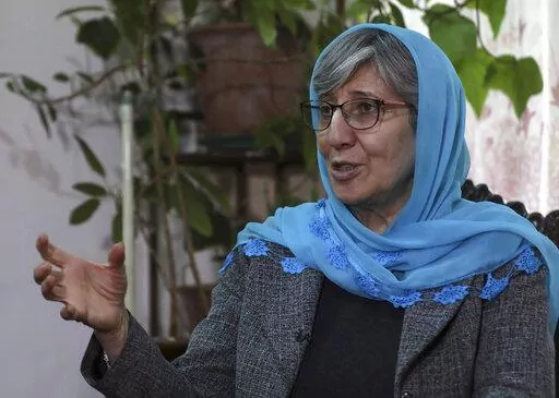 Sima Samar, a prominent activist and physician, who has been fighting for women's rights in Afghanistan for the past 40 years, speaks during an interview at her house in Kabul, Afghanistan, on March 6, 2021, six months before the Taliban takeover of her country. A year after that seismic shift, Samar says that she is still heartbroken over what happened to Afghanistan. (AP Photo/Rahmat Gul)