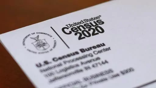An envelope containing a 2020 census letter mailed to a U.S. resident sits on a desk on on April 5, 2020, in Detroit. The U.S. Census Bureau is contemplating getting rid of a question about a person's ancestry on its most comprehensive survey, saying it may duplicate a newly-revised race question that allows respondents to write in from where they or their antecedents came. (AP Photo/Paul Sancya, File)