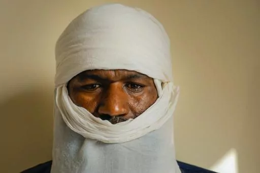 Mouhamadou Ibrahim, a former jihadi commander who decided to defect, poses for a photograph in Niamey, Niger, Friday, Aug. 18, 2023. The future of a program in Niger that encourages jihadi fighters to defect and reintegrate into society is unclear after mutinous soldiers toppled the government that launched it. (AP Photo/Sam Mednick)