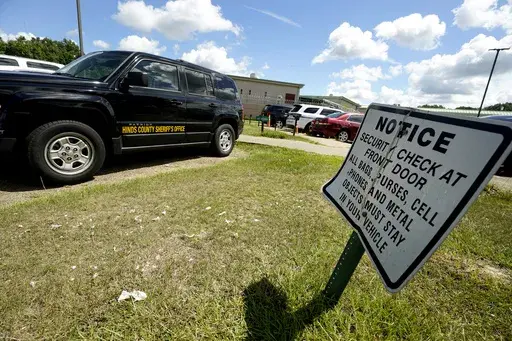 Visitor information signs dot the entrance to the Hinds County Detention Facility in Raymond, Miss., Aug. 1, 2022. (AP Photo/Rogelio V. Solis, File)