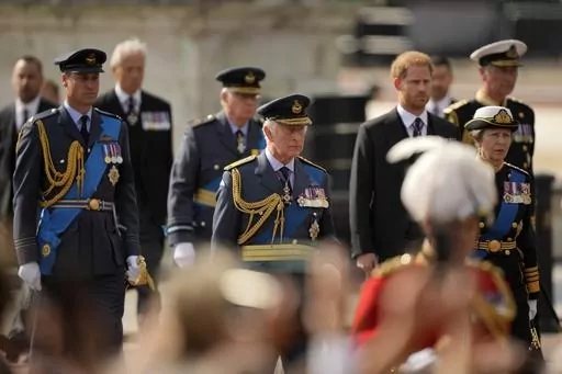 King Charles III and other members of Royal family follow the coffin of Queen Elizabeth II, during a procession from Buckingham Palace to Westminster Hall in London, Wednesday, Sept. 14, 2022. King Charles III will hope to keep a lid on those tensions when his royally blended family joins as many as 2,800 guests for the new king’s coronation on May 6 at Westminster Abbey. All except Meghan, the Duchess of Sussex, who won’t be attending. (AP Photo/Markus Schreiber, File)