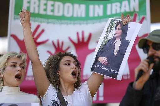 Iranians who live in Brazil protest against the death of Iranian woman Mahsa Amini, who died in Iran while in police custody, in Sao Paulo, Brazil, Friday, Sept. 23, 2022. As anti-government protests roil cities and towns in Iran for a fourth week, sparked by the death of a 22-year-old woman detained by Iran's morality police, tens of thousands of Iranians living abroad have marched on the streets of Europe, North America and beyond in support of what many believe to be a watershed moment for th