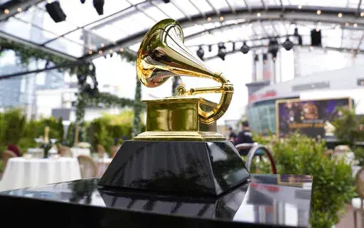 A decorative grammy is seen before the start of the 63rd annual Grammy Awards at the Los Angeles Convention Center on Sunday, March 14, 2021. The upcoming Grammy Awards have been postponed due to what organizers called "too many risks" due to the omicron variant. The ceremony had been scheduled for Jan. 31st in Los Angeles with a live audience and performances. (AP Photo/Chris Pizzello, File)