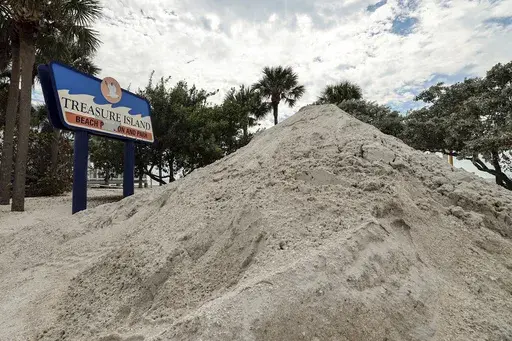 Sand washed ashore by the surge of Hurricane Helene is piled, Oct. 2, 2024, in Treasure Island, Fla. (AP Photo/Mike Carlson, File)