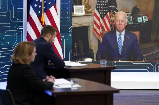 President Joe Biden listens as he attends virtually an event in the South Court Auditorium on the White House complex in Washington, Monday, July 25, 2022. Biden, who continues to recover from his coronavirus infection, spoke virtually with business executives and labor leaders to discuss the Chips Act, a proposal to bolster domestic manufacturing. (AP Photo/Susan Walsh)