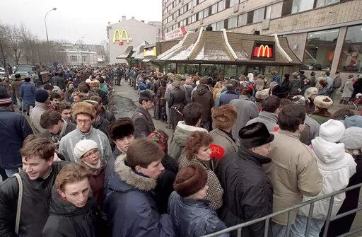 Hundreds of Muscovites line up outside the first McDonald's restaurant in the Soviet Union on its opening day, in Moscow, Wednesday, Jan. 31, 1990. Two months after the Berlin Wall fell, another powerful symbol opened its doors in the middle of Moscow: a gleaming new McDonald’s. It was the first American fast-food restaurant to enter the Soviet Union. But now, McDonald's is temporarily closing its 850 restaurants in Russia in response to the Ukraine invasion. (AP Photo, File)