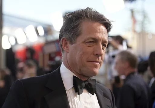 Hugh Grant arrives at the 23rd annual Screen Actors Guild Awards at the Shrine Auditorium & Expo Hall in Los Angeles, Sunday Jan. 29, 2023. A London court on Friday rejected an attempt by the publisher of The Sun tabloid to throw out a lawsuit by actor Hugh Grant alleging that journalists and investigators it hired illegally snooped on him. (Photo by Richard Shotwell/Invision/AP, File)