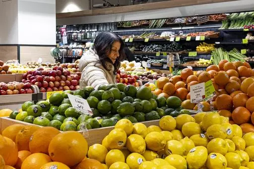 A woman browses produce for sale at a grocery store, Friday, Jan. 19, 2024, in New York. In final rule changes announced Tuesday, April 9, 2024, the federal program that helps millions of low-income mothers, babies and young kids will soon emphasize more fruits, vegetables and whole grains, as well as provide a wider choice of foods from different cultures. (AP Photo/Peter K. Afriyie, File)